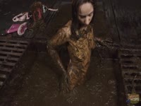 Aiyana completely covered and bathing in shot